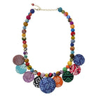 A multicolor beaded necklace is shown on a white background.