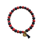 A red and blue beaded bracelet against a white background.