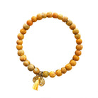 A yellow beaded bracelet against a white background.